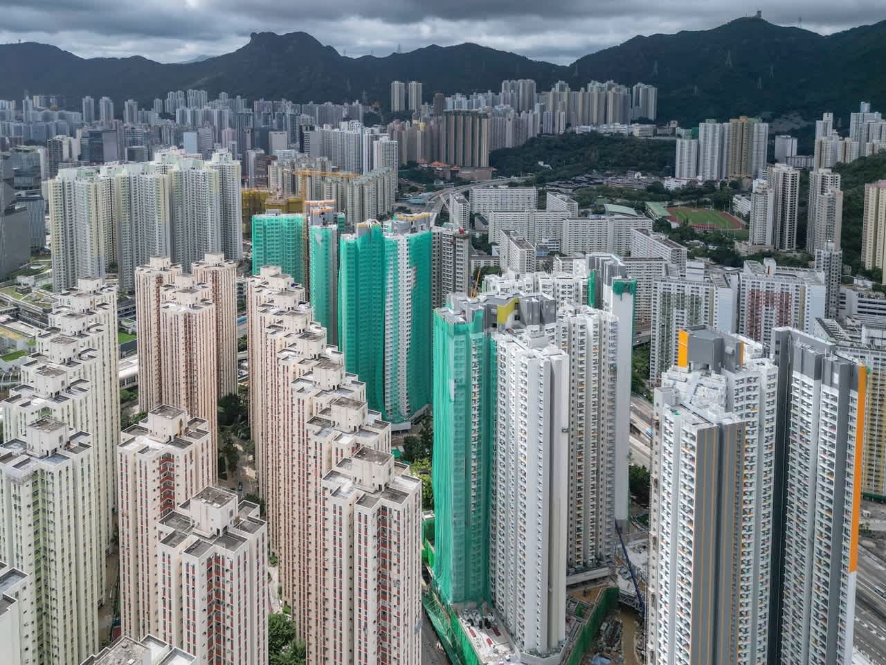 High-rise residential buildings in Kowloon Bay area, including ongoing construction at Hong Chui Court under the Green Form Subsidised Home Ownership Scheme