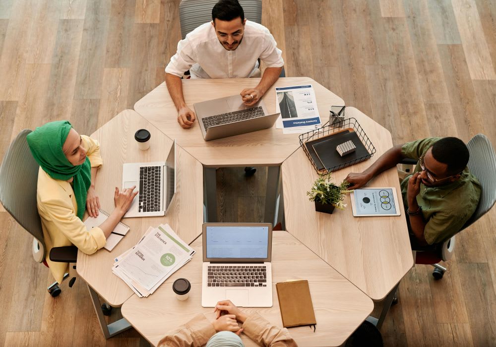 Professionals collaborating around a table in a modern office setting