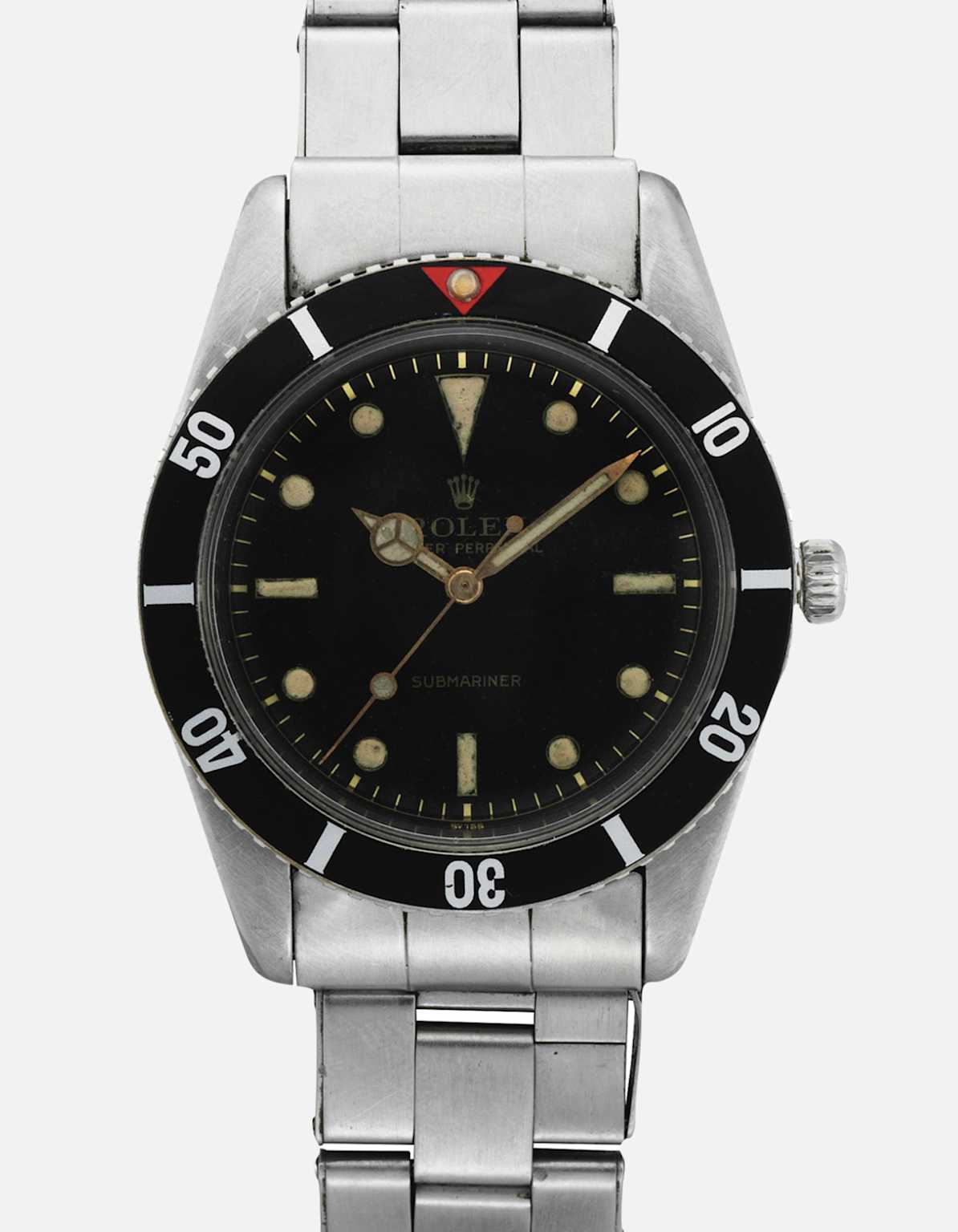 Vintage Rolex Submariner 6204 from 1953 with black dial and stainless steel bracelet, one of the first models of the iconic dive watch series