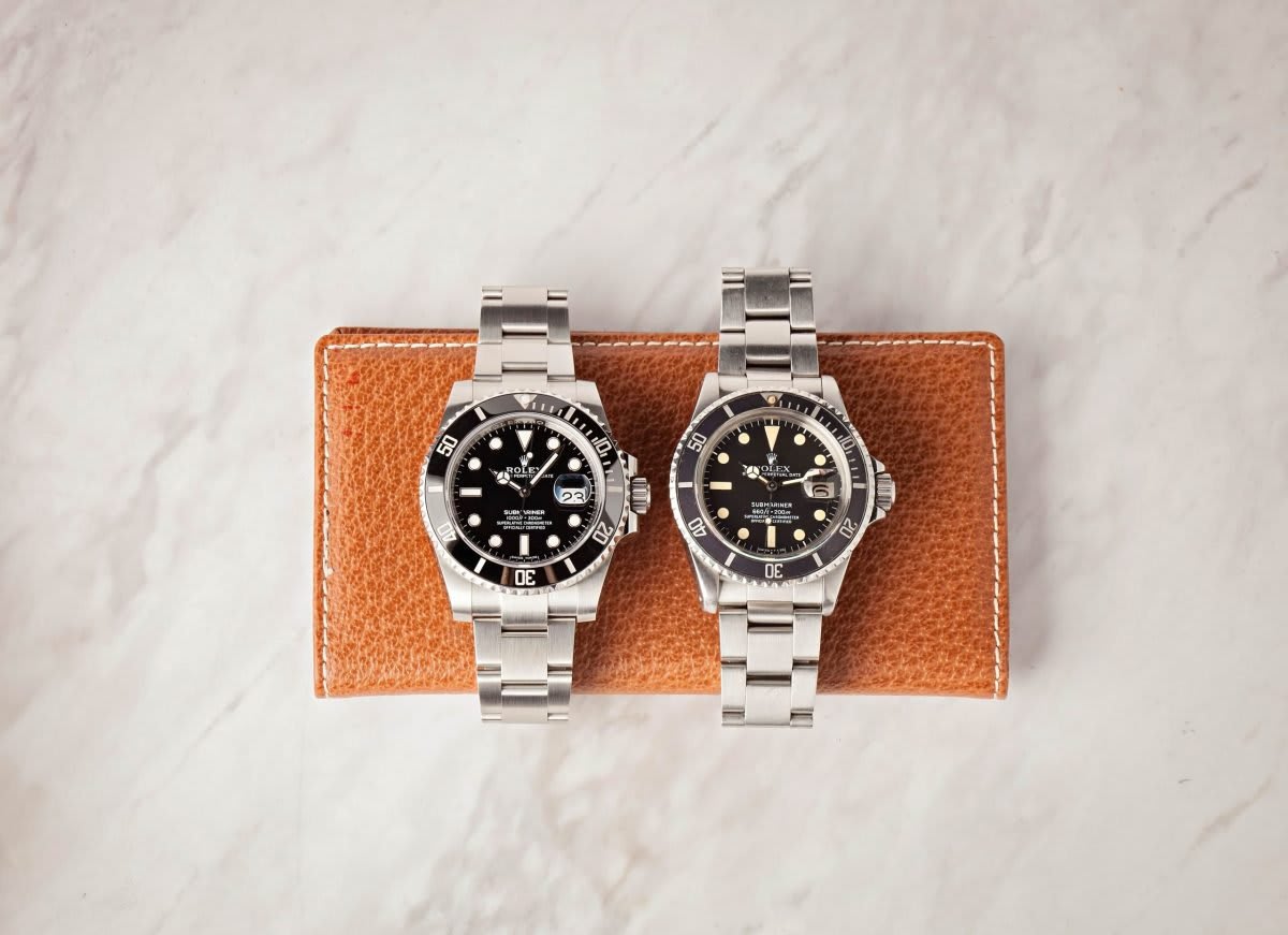 A modern Rolex Submariner Date alongside a vintage Rolex Submariner Date, showcasing design evolution