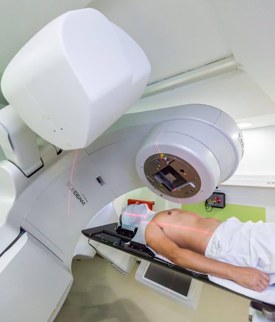 Patient positioned for a radiotherapy session using a linear accelerator with laser alignment