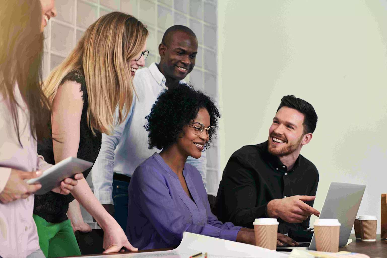 A diverse group of professionals collaborating and engaging during a business meeting or planning session