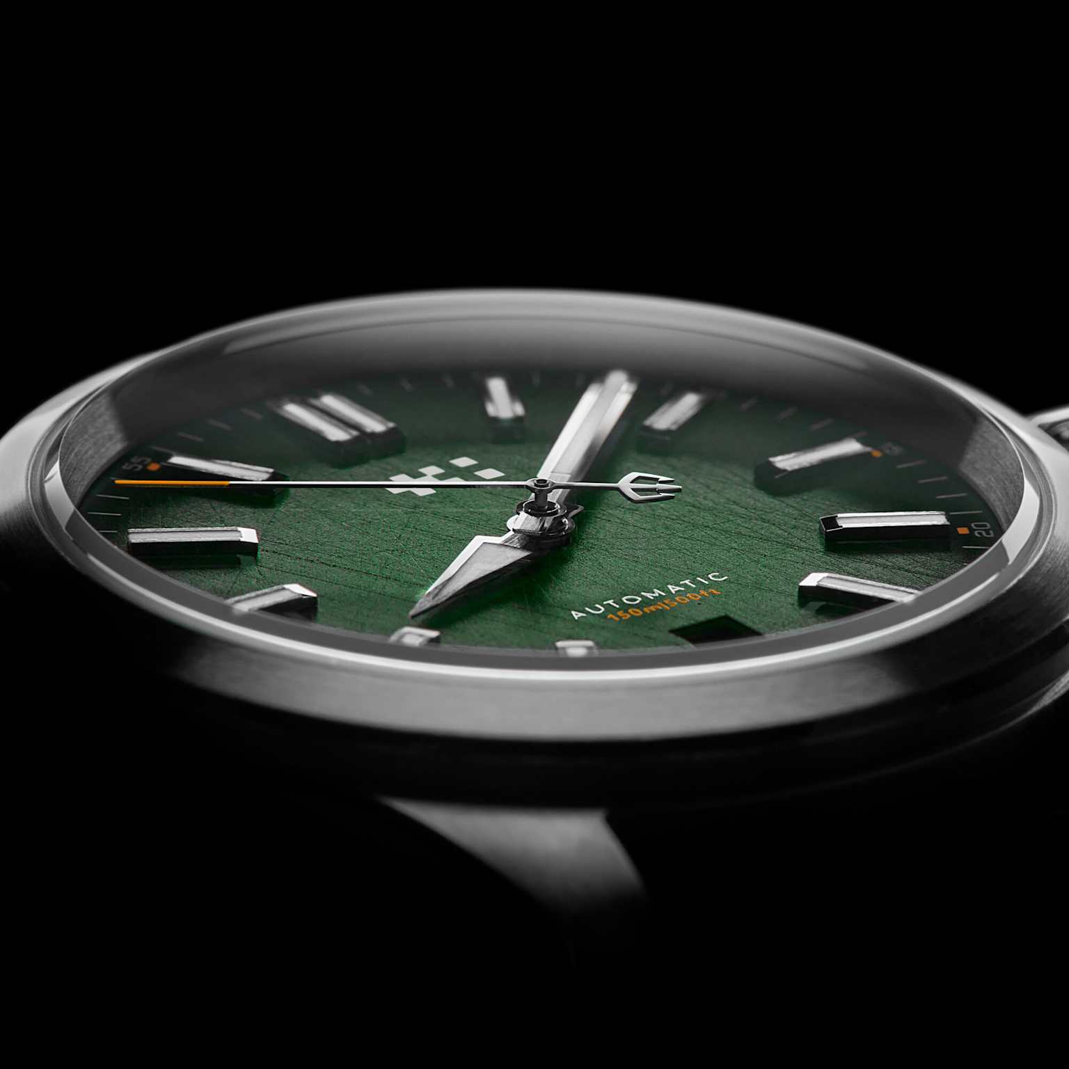 Close-up of the Christopher Ward C63 Sealander watch, showcasing its textured green dial and distinctive design