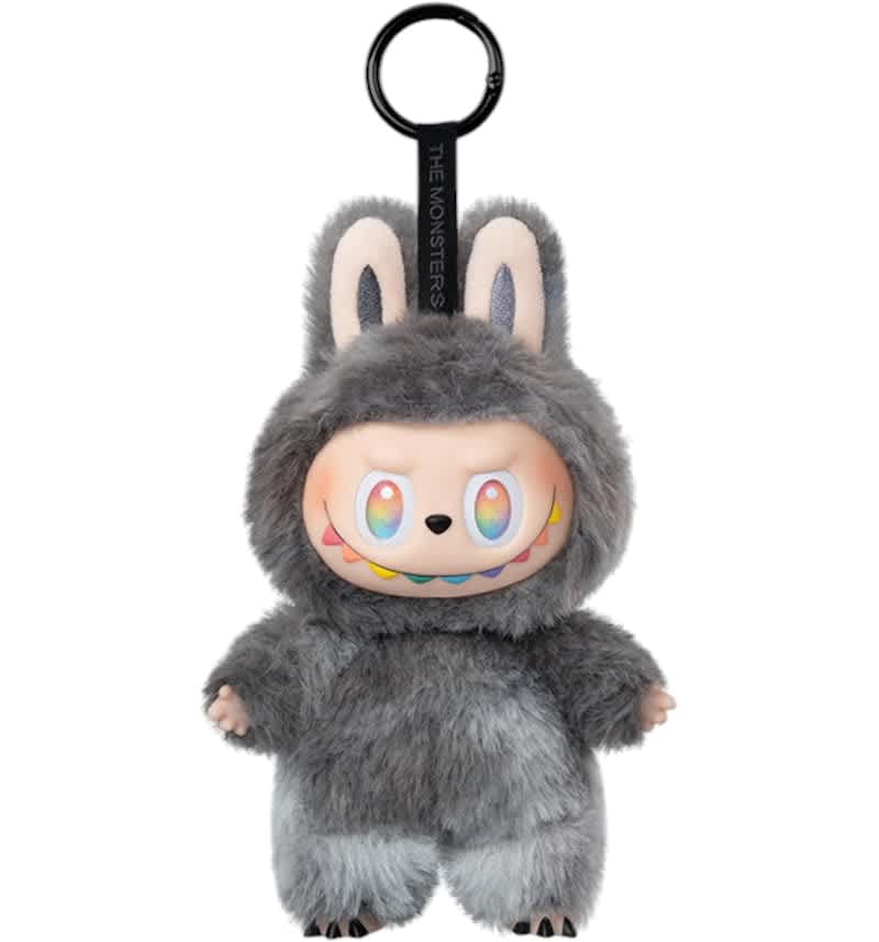 A Labubu The Monsters Big Into Energy series secret character, a grey plush toy with rainbow eyes and a colorful smile