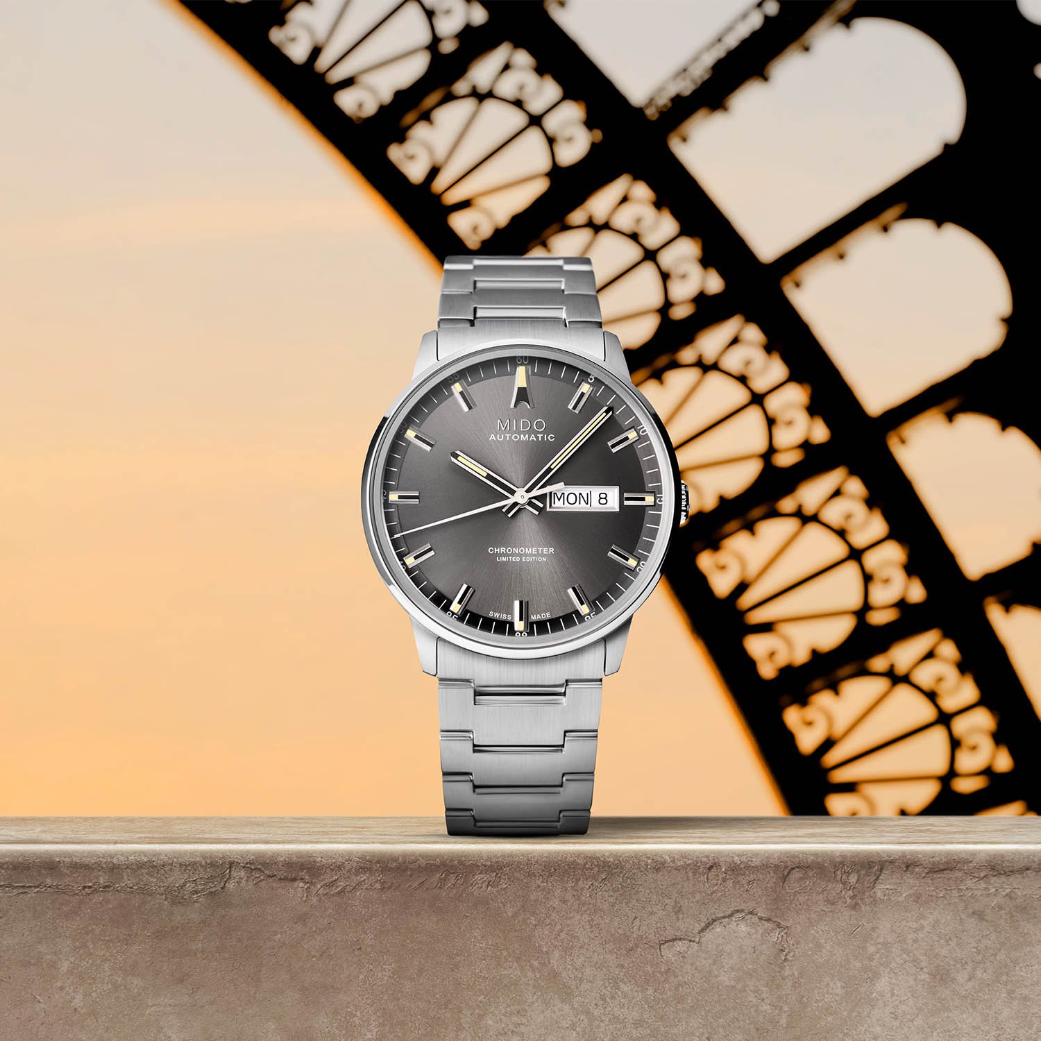 A MIDO watch with an Eiffel Tower silhouette in the background, highlighting architectural-inspired design