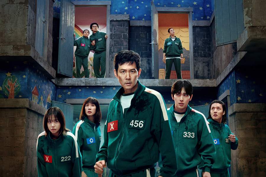 Key characters in their green tracksuits stand in a tense, surreal environment, evoking the atmosphere of Squid Game.