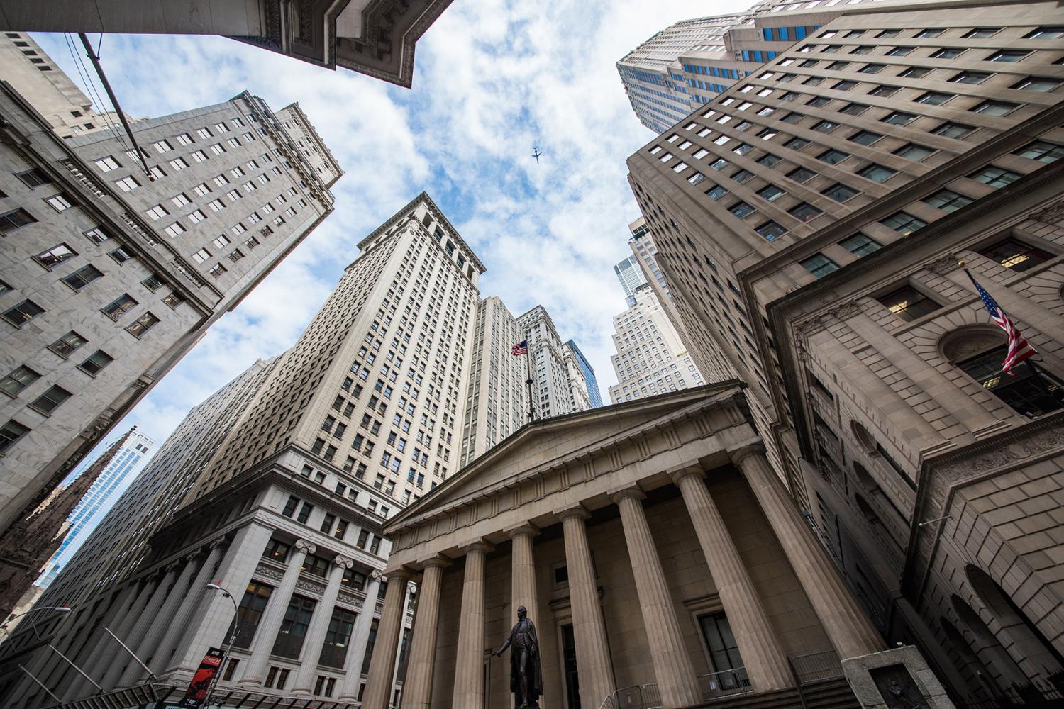 Looking up at the towering buildings of Wall Street, New York City, the symbolic heart of American finance