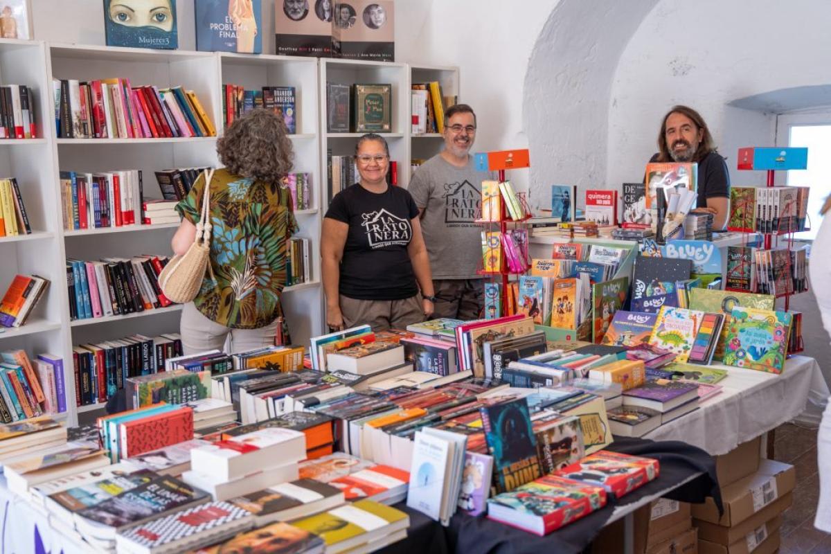 Vendors and visitors among numerous book displays at a lively book fair