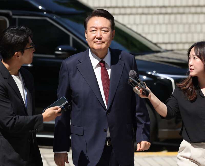 President Yoon Suk-yeol interacting with reporters