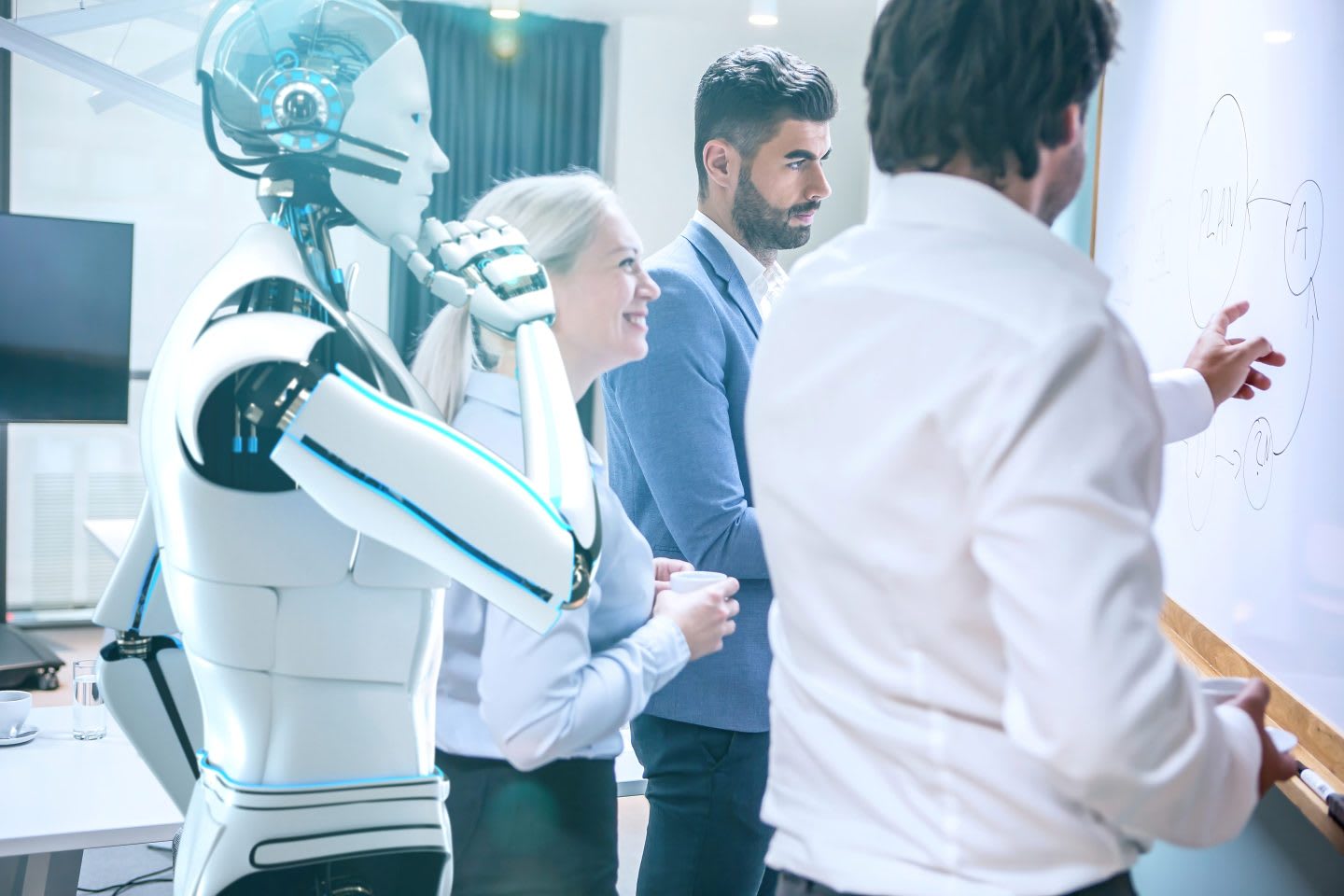 AI and human professionals collaborating in a modern office setting, illustrating hybrid staffing solutions.