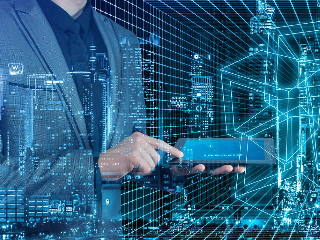 A business professional interacting with a digital tablet, symbolizing financial technology and the advancements in tokenization