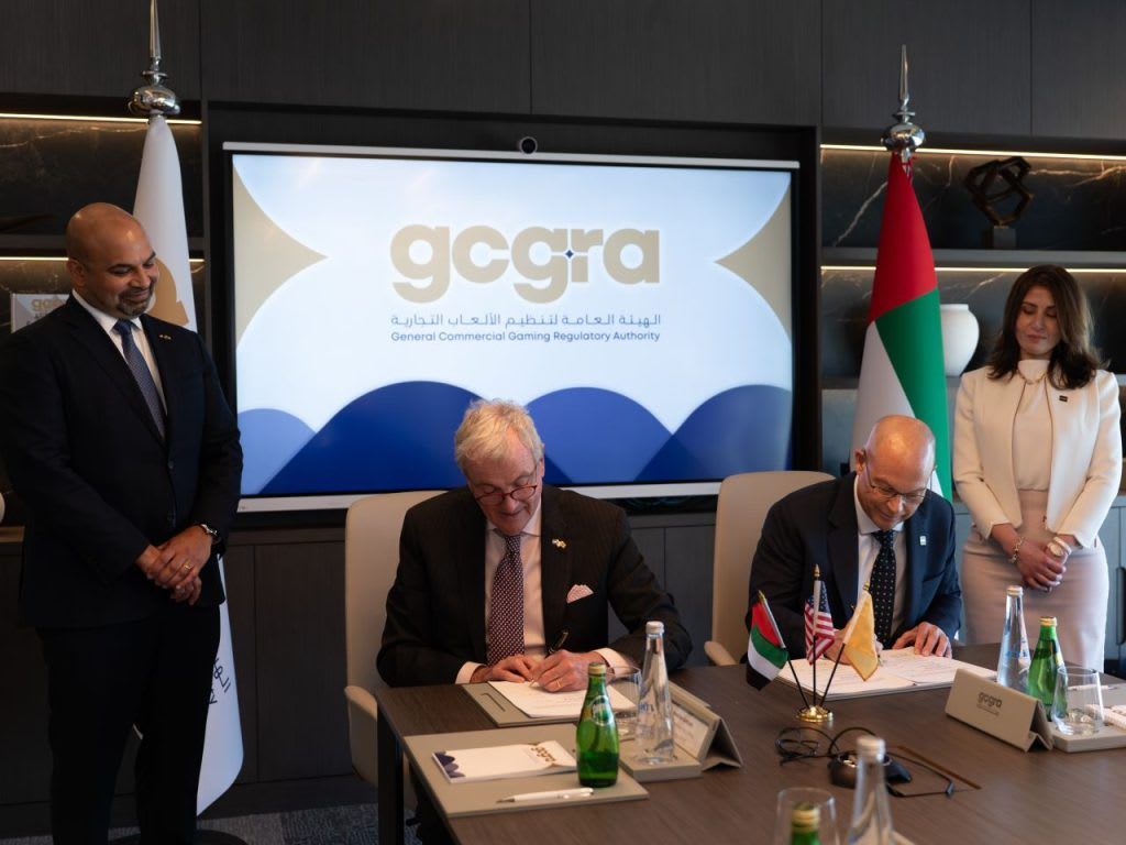 Officials engage in a signing ceremony related to the General Commercial Gaming Regulatory Authority (GCGRA)
