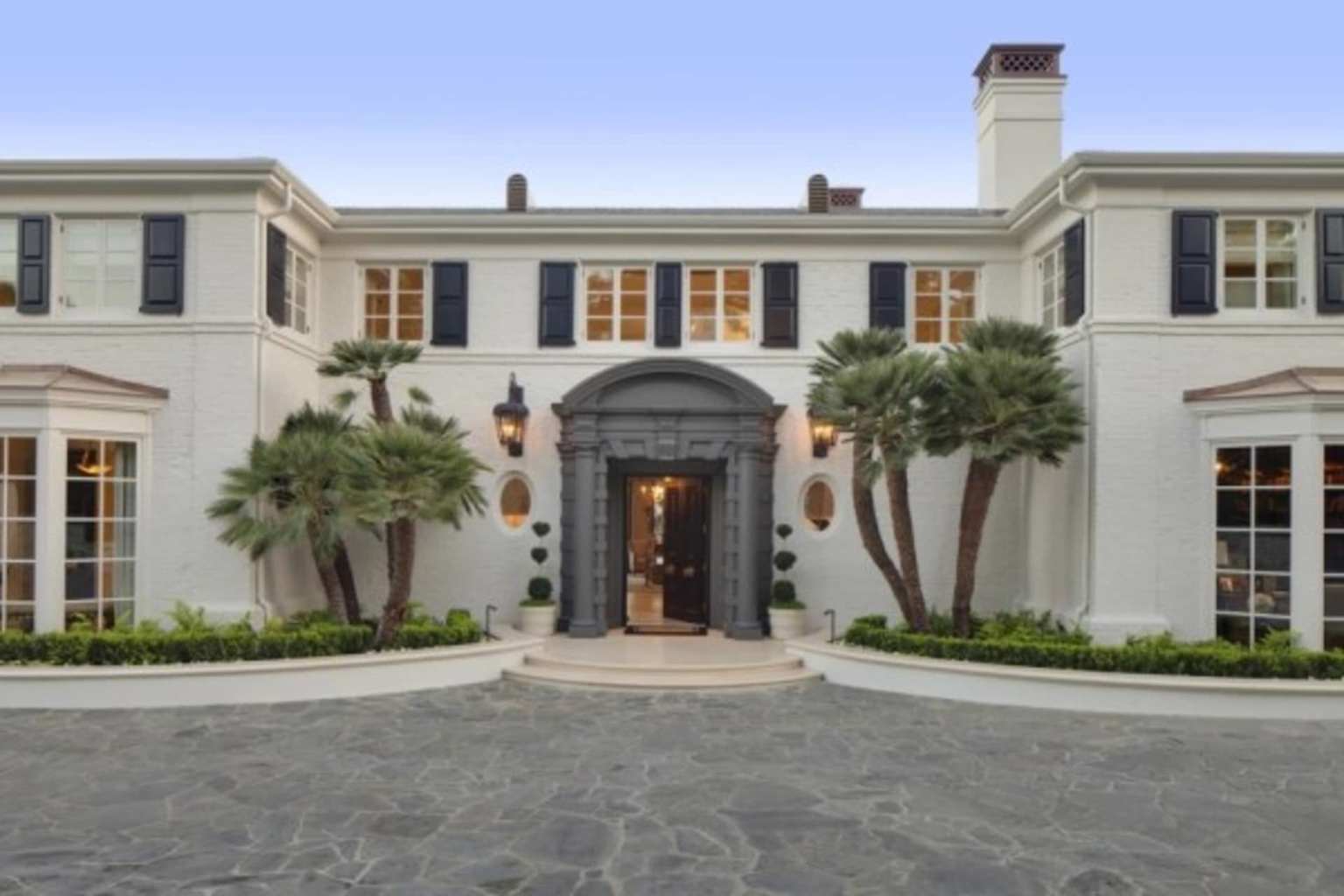 A stately luxury mansion, representative of the exclusive properties found in off-market real estate transactions