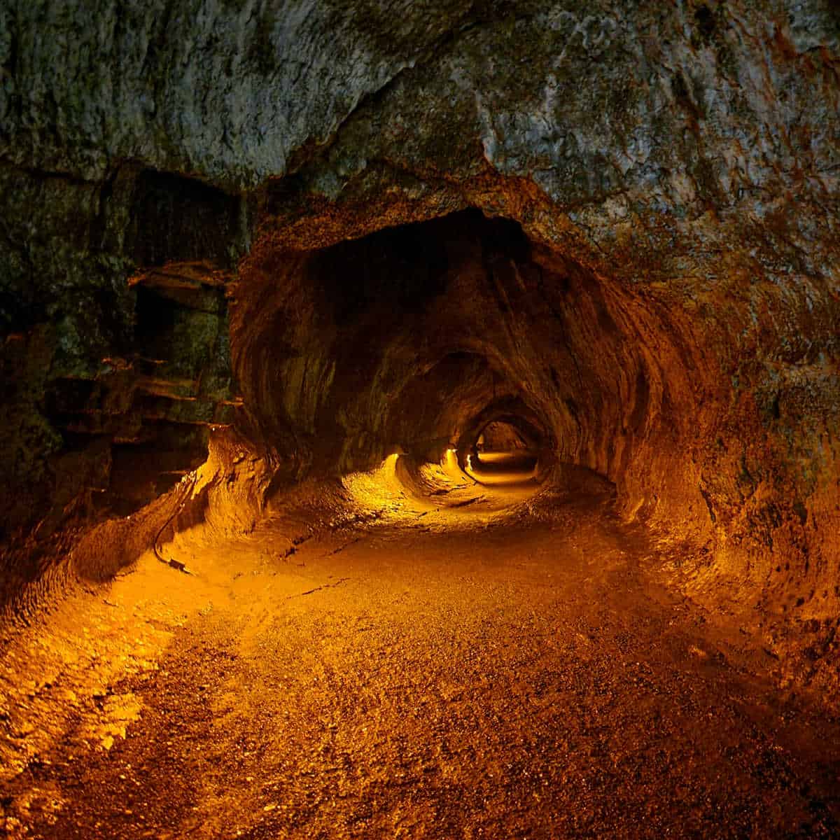 Interior view of Nahuku Thurston Lava Tube showcasing the glowing rock formations inside Hawaii Volcanoes National Park