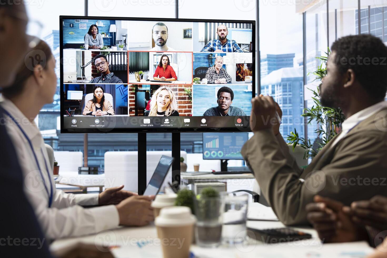 Diverse professionals engaged in a remote video conference call for international team collaboration.