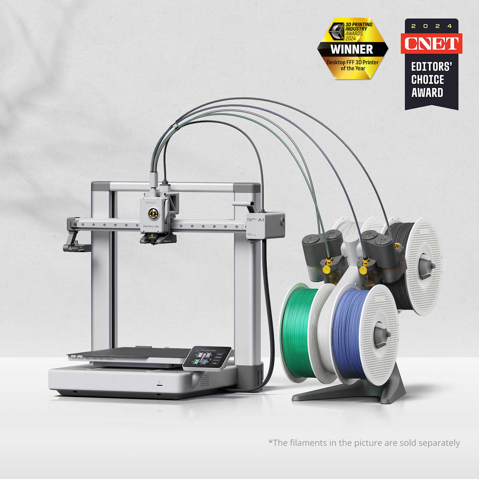 Bambu Lab A1 3D printer with AMS multi-color filament system, winner of 2024 industry awards for innovation and quality.