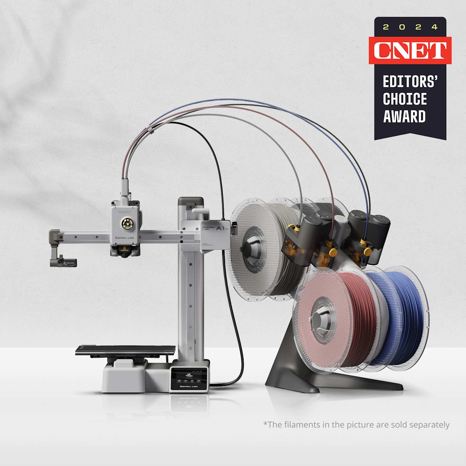 Bambu Lab A1 Mini 3D printer with multi-filament system and CNET 2024 Editors' Choice Award.