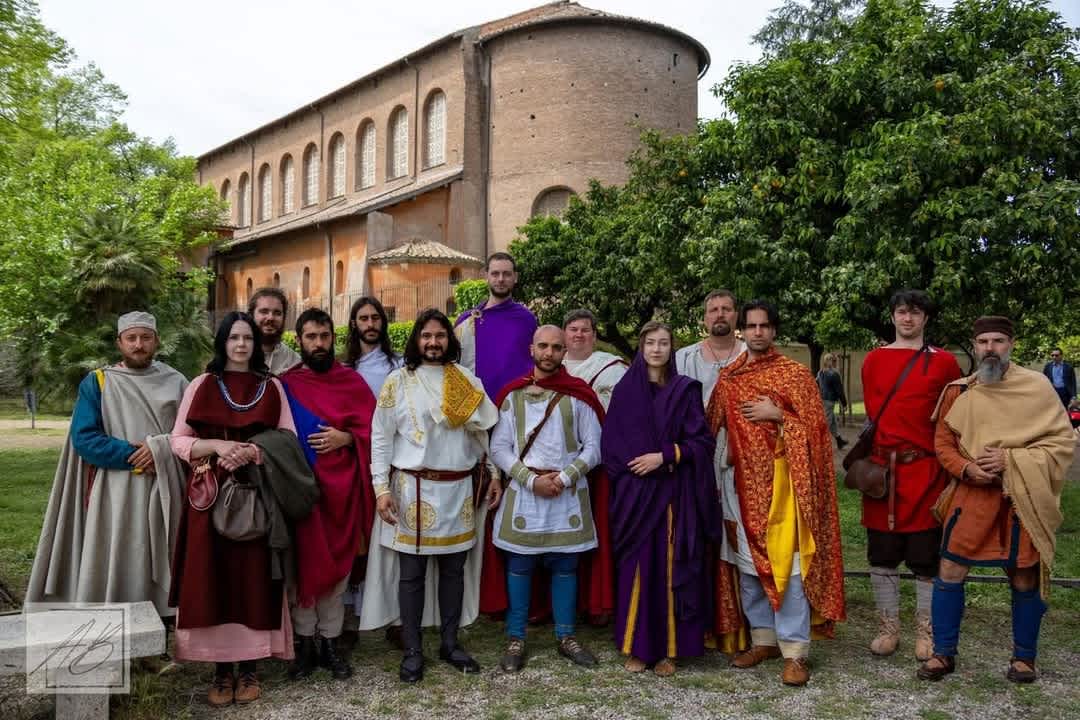 Group of reenactors in historical costumes at an outdoor event