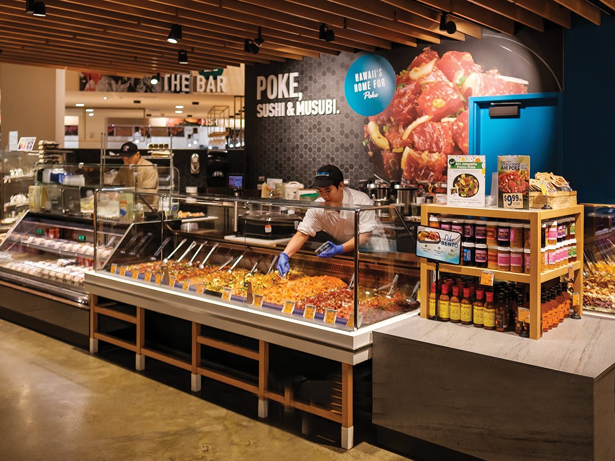 Poke counter at Foodland supermarket showcasing authentic Hawaiian poke, a popular and affordable local dining option
