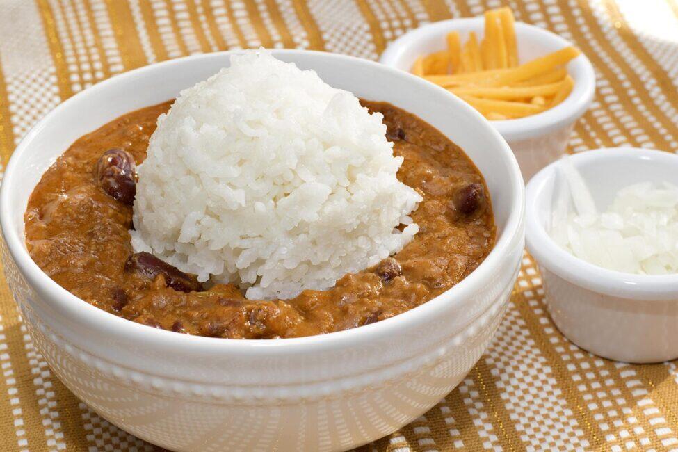 A classic Hawaiian chili plate lunch with rice, cheese, and onions from Zippy's, a beloved local restaurant chain
