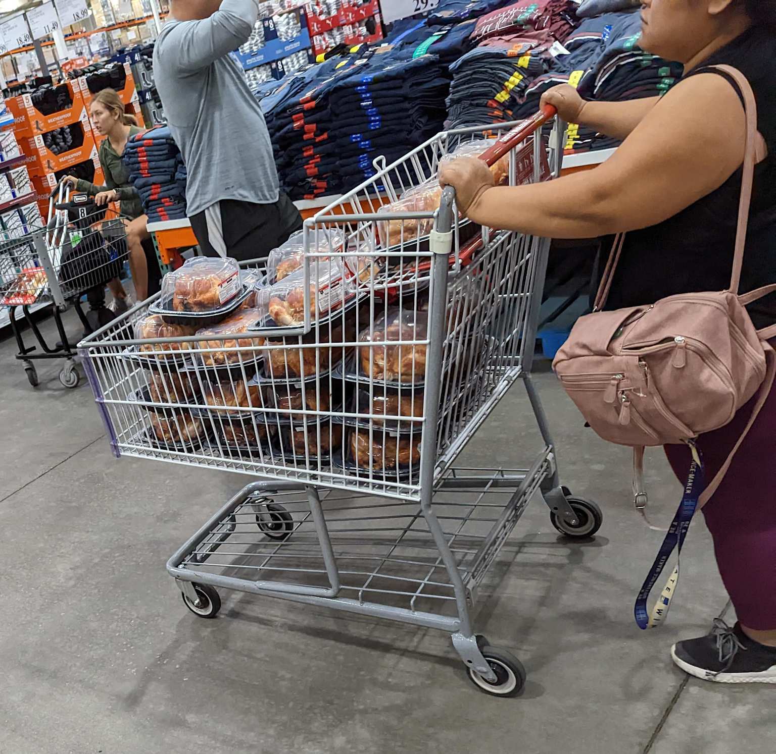 Costco shopping cart filled with bulk rotisserie chickens, a local Hawaii strategy to save on dining costs
