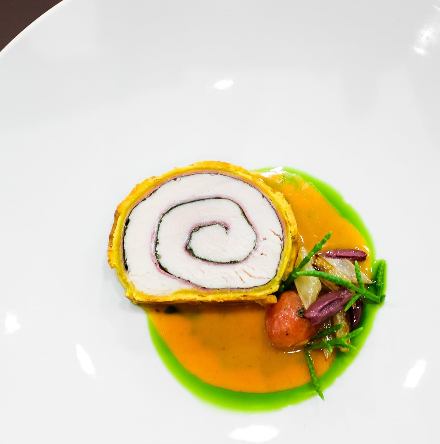 Fine dining dish from Senia restaurant in Hawaii showcasing artistic presentation and vibrant flavors