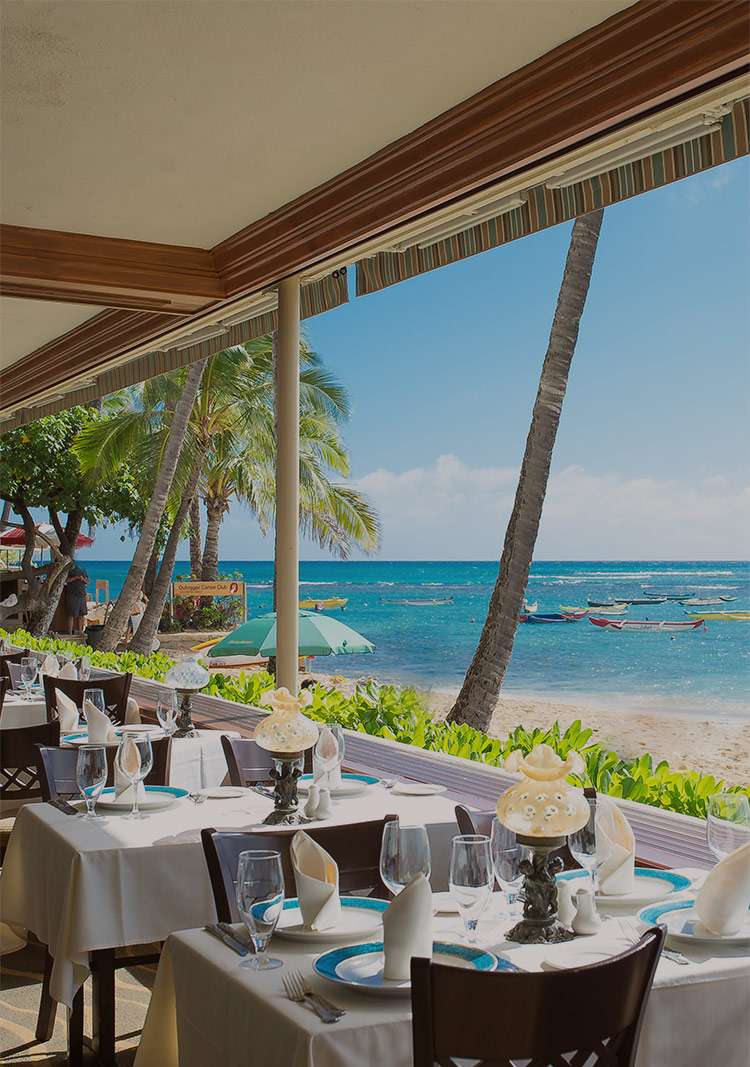 Michel's Hawaii restaurant offers elegant beachfront dining with stunning ocean views and refined table settings