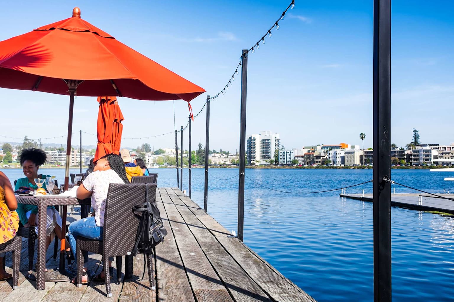 Outdoor waterfront dining at Lake Merritt in Oakland offers a vibrant and affordable eating experience with scenic lake views