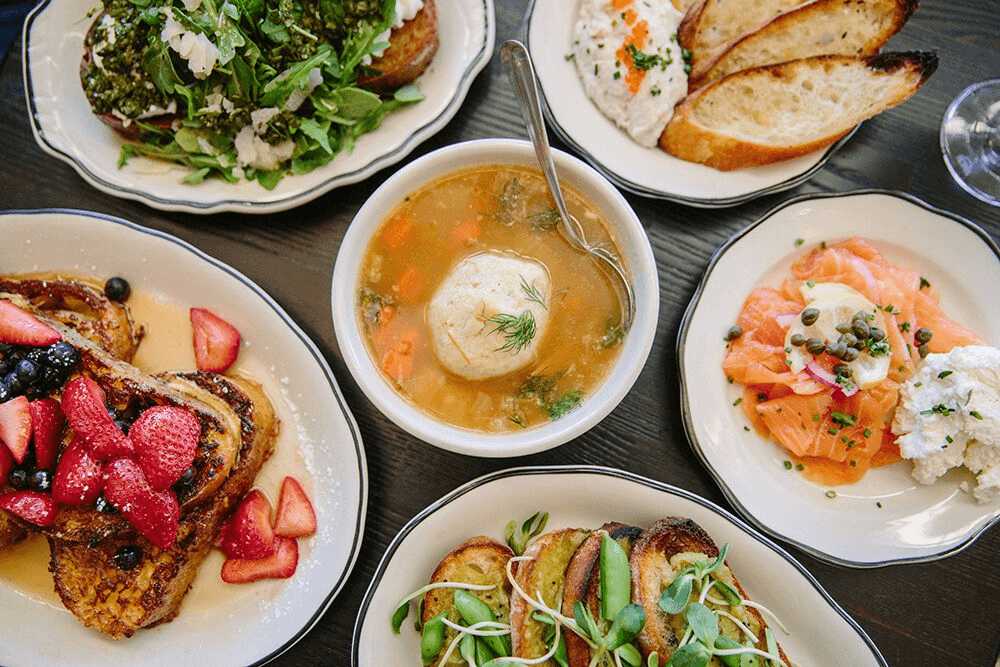 A variety of diverse and colorful dishes representative of Oakland's vibrant food scene
