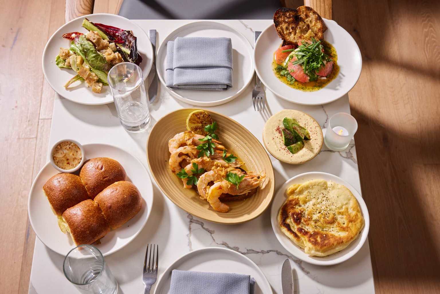 A diverse spread of dishes showcasing fresh and flavorful affordable eats in Oakland's restaurant scene