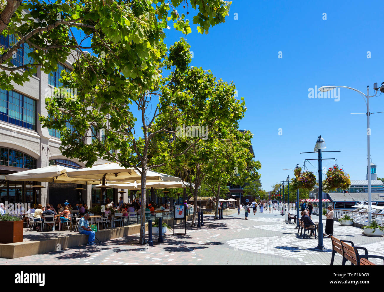 Outdoor dining and pedestrian walkway at Jack London Square waterfront in Oakland, California