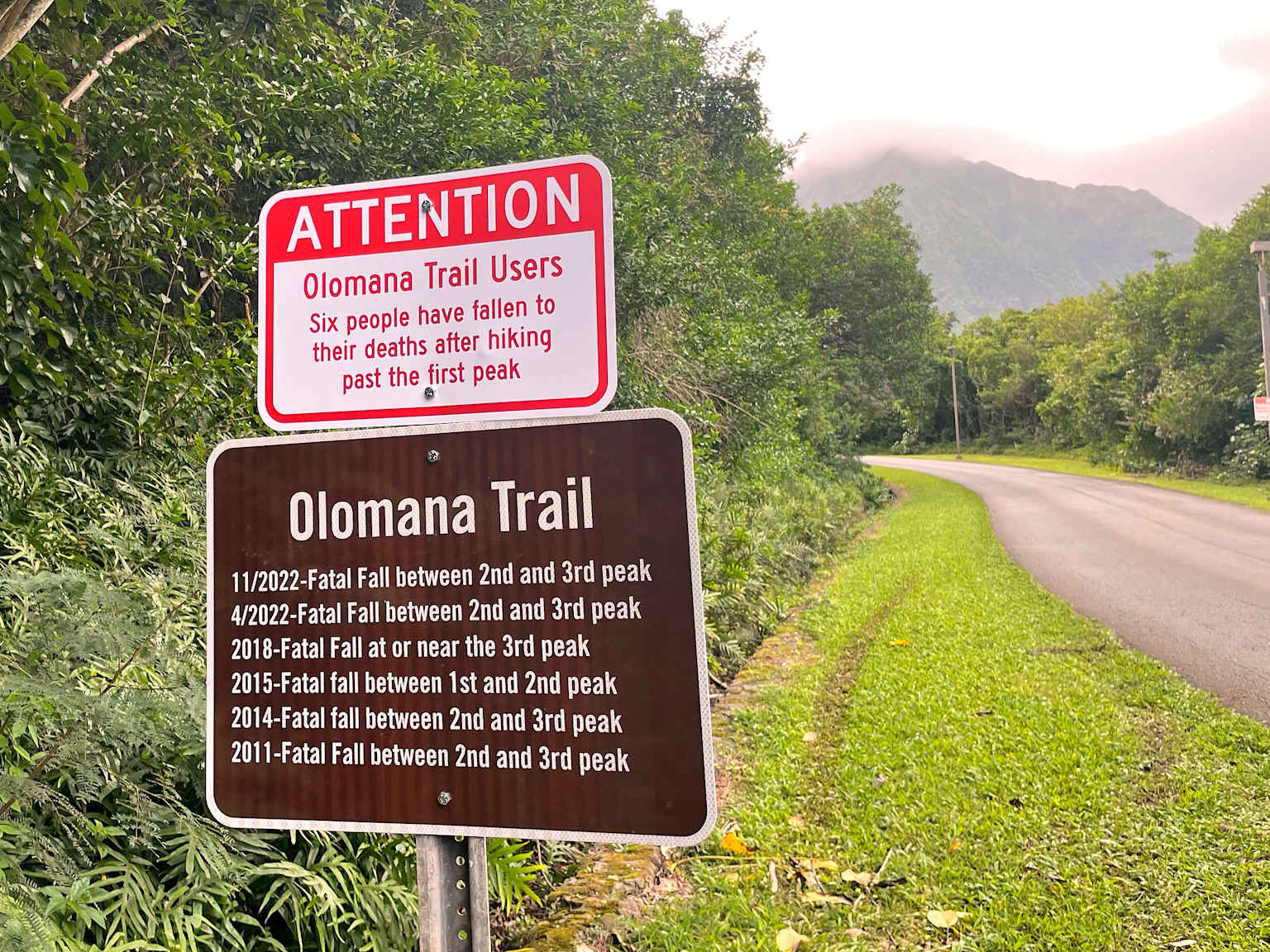 Warning signs on Olomana Trail detail multiple fatal falls highlighting hiking dangers in Hawaii