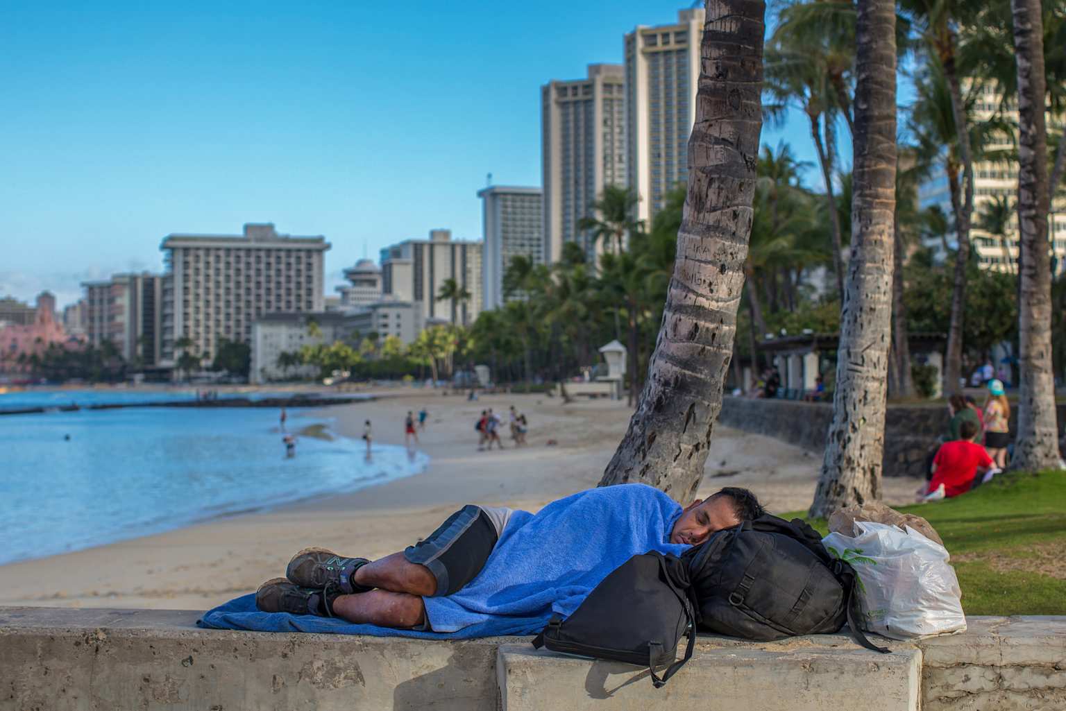 Homelessness contrasts sharply with Hawaii's idyllic beach scene in urban Honolulu areas popular with tourists