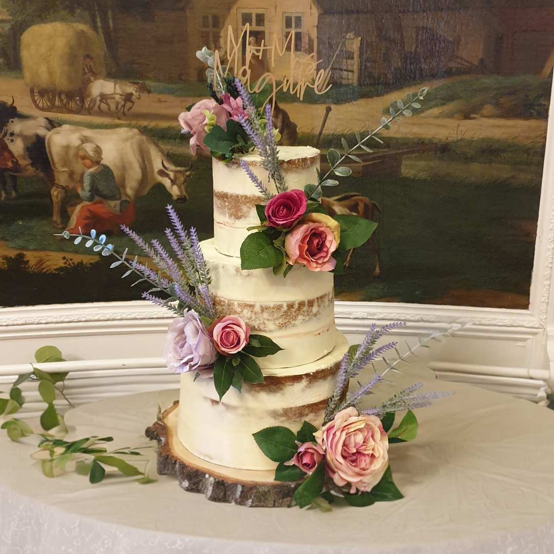 Elegant multi-tier wedding cake with floral decorations