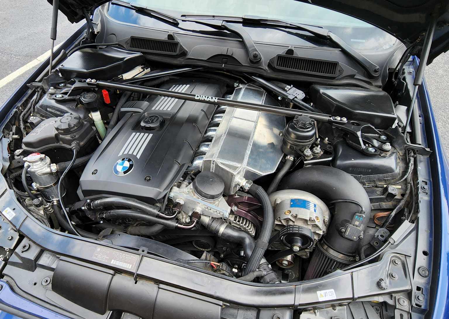 Modified BMW E90 N52 engine with aftermarket turbocharger and intercooler upgrades