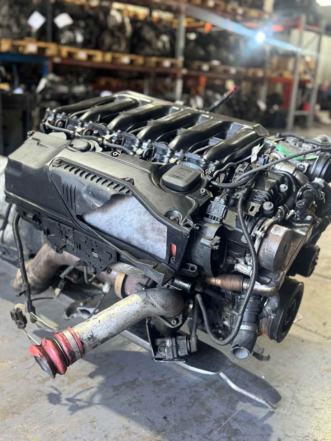 BMW M57 diesel engine used in E90 series, displayed in a workshop setting