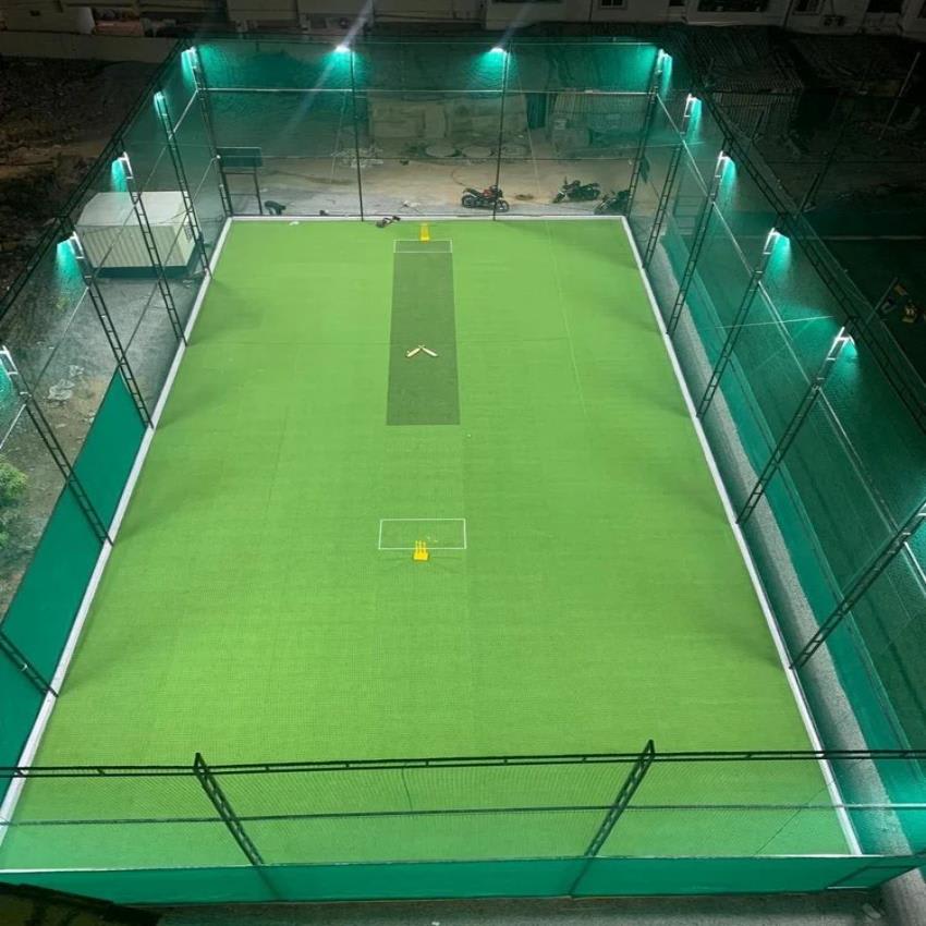 Indoor cricket turf ground at night