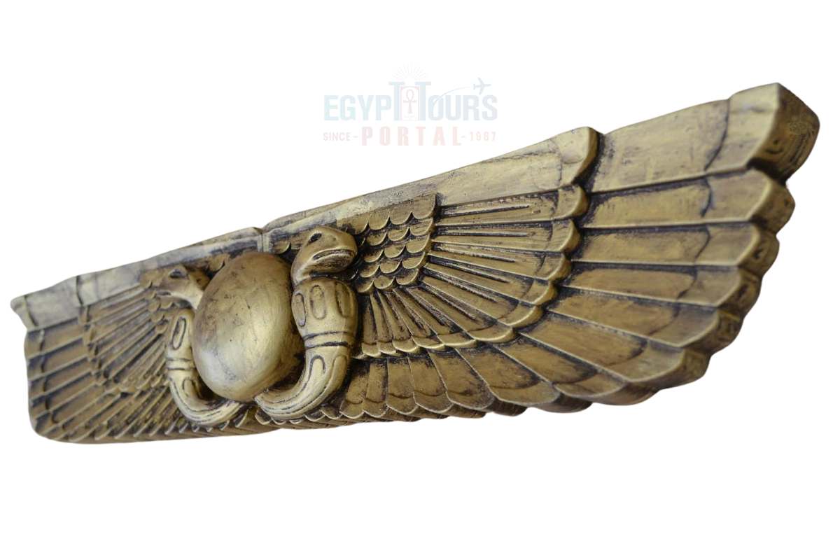 Winged solar disk with serpent heads, a symbol linked to ancient Egyptian deity Amon and divinity.