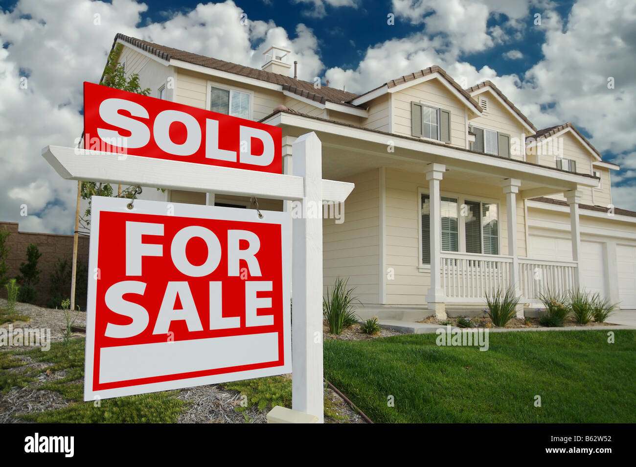 House with sold sign - Sell Property