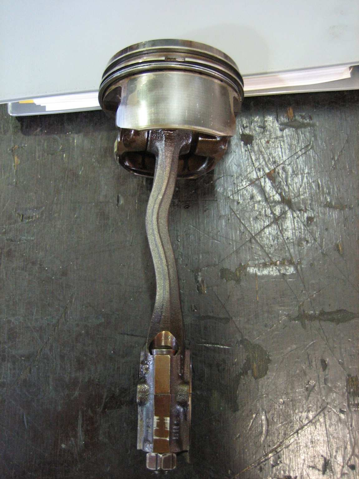 Bent connecting rod and piston damaged by engine hydrolock