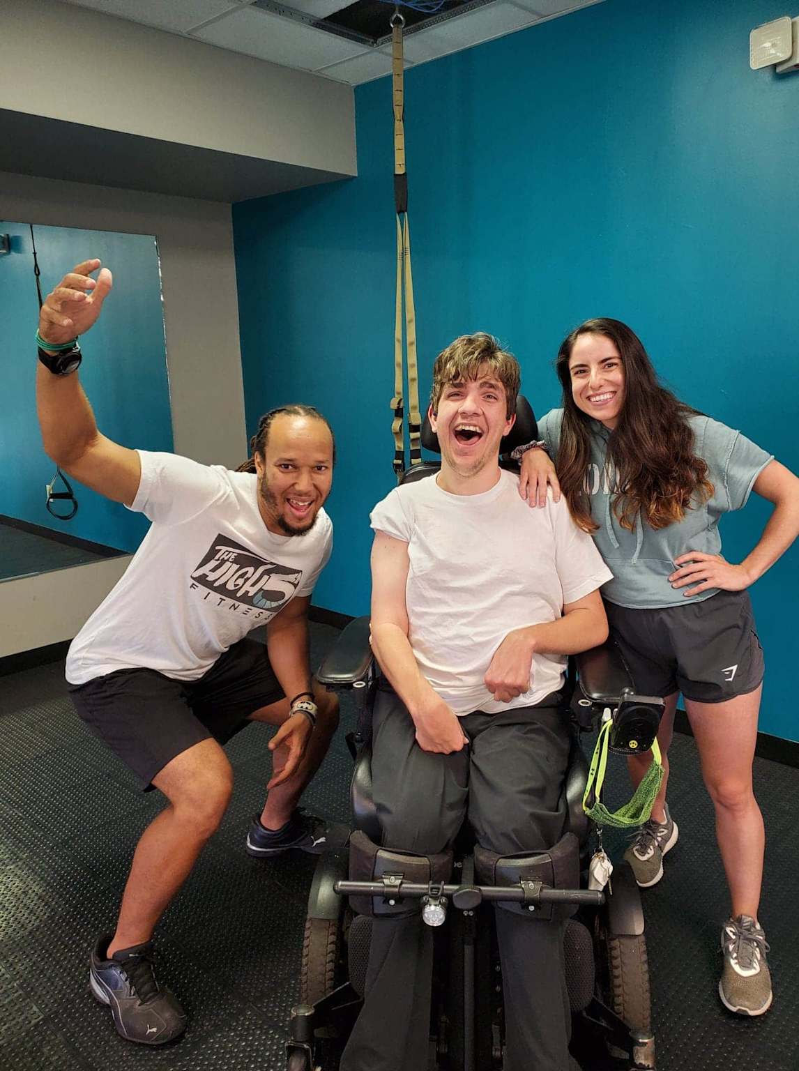 Personal training session with a client using a wheelchair, highlighting support and inclusivity in fitness for people with disabilities