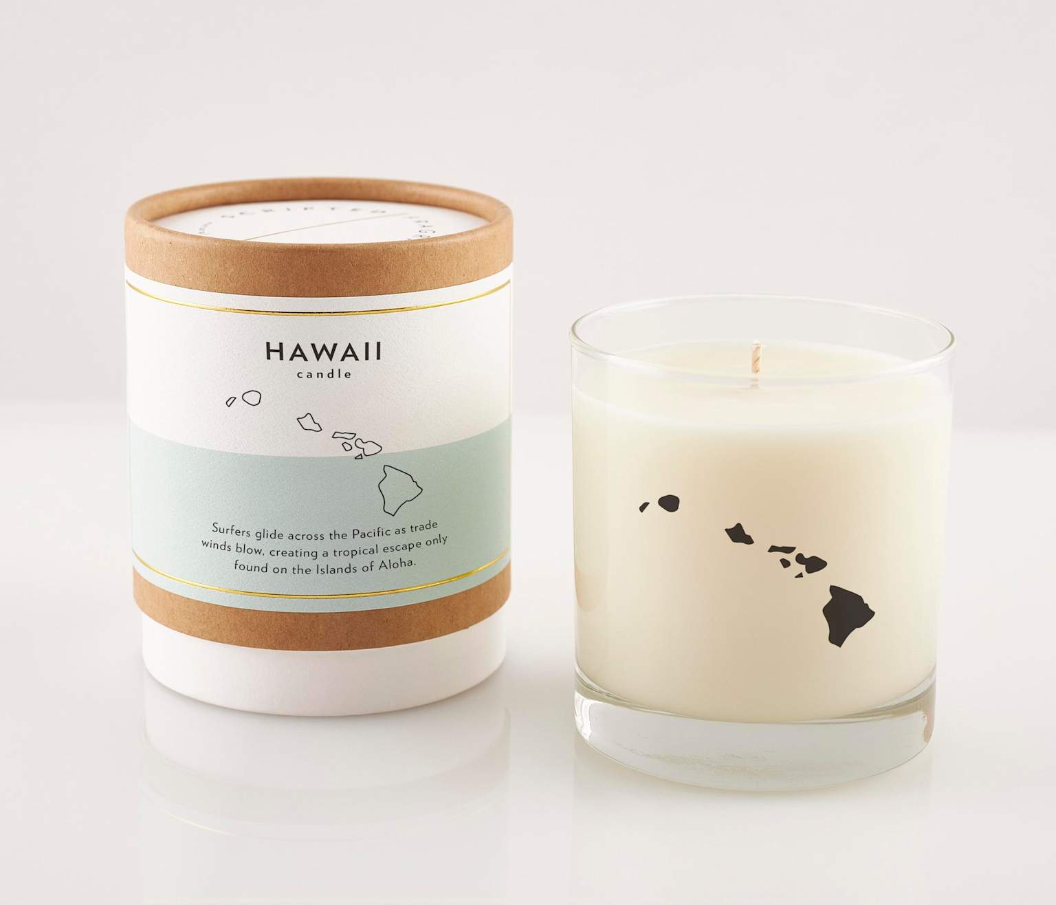 A Hawaii-themed soy wax candle featuring the islands map, representing a sophisticated, local souvenir option from the Islands of Aloha