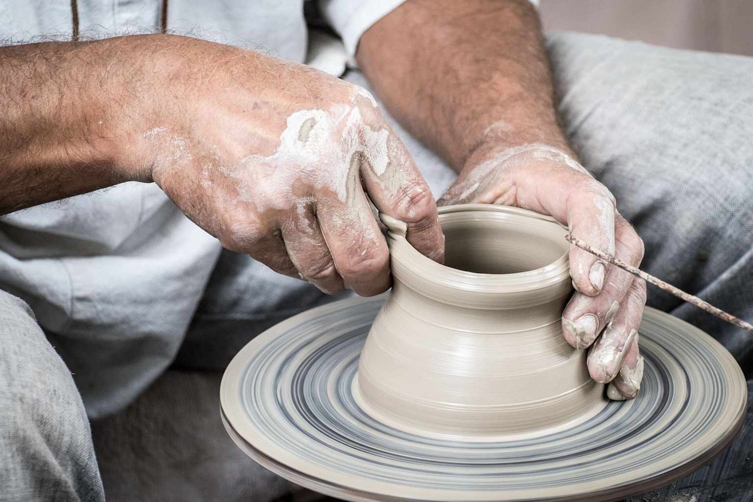 Artisan crafting pottery