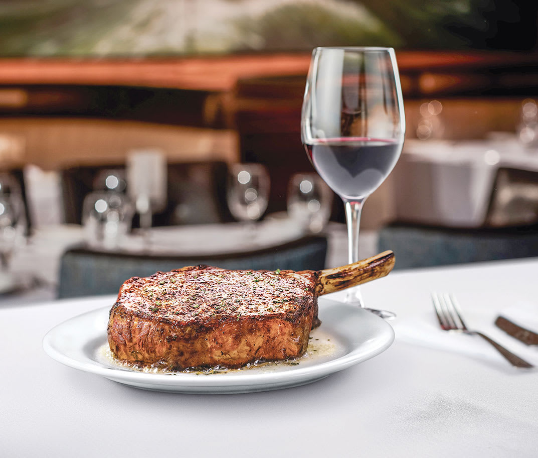 Prime ribeye steak paired with red wine at Ruth's Chris Steak House in Hawaii