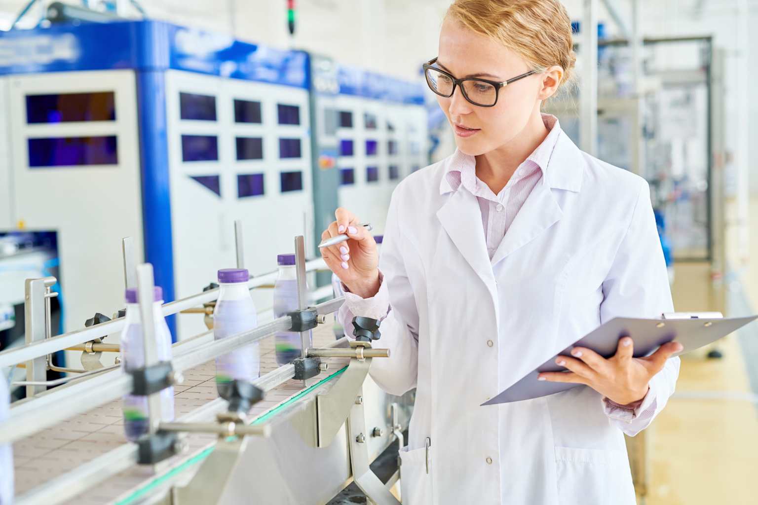 Quality control inspection at a food and beverage production line to ensure safety and standards compliance