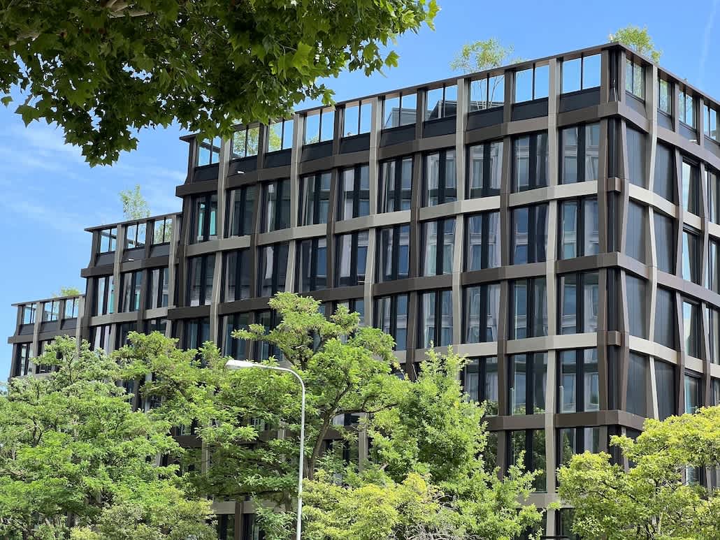 Modern sustainable office building in Germany with greenery and glass façade showing ESG principles