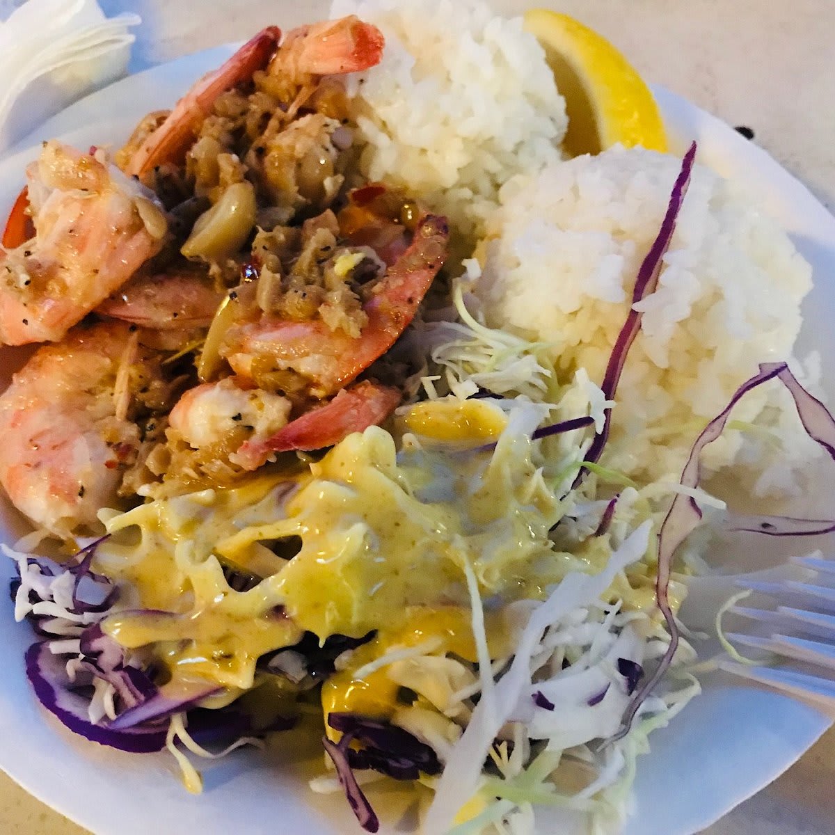 Savage Shrimp garlic shrimp plate served with rice and cabbage salad, a popular Kauai food truck dish