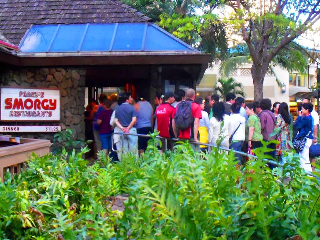 People lining up outside Perry's Smorgy Restaurant, a once-popular Waikiki smorgasbord dining spot