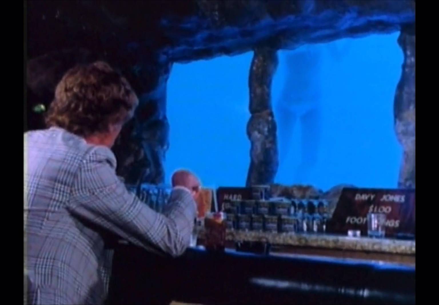 Interior view of Moose McGillycuddy's bar on Lewers Street Waikiki showing its distinctive tropical ambiance and nostalgic bar setup