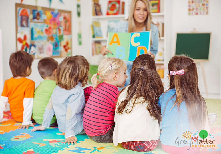 Kindergarten children in colorful classroom